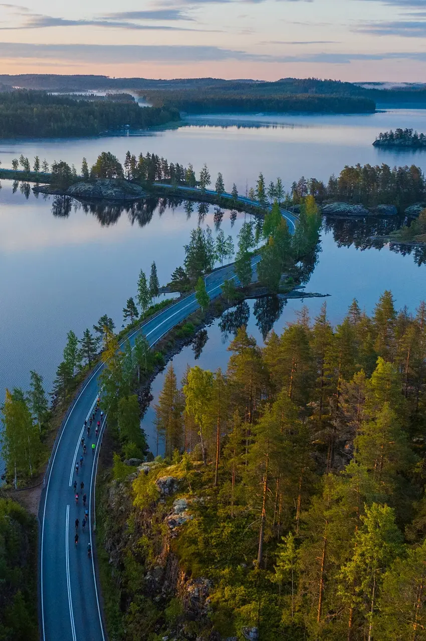 cycling on the road over the lake
