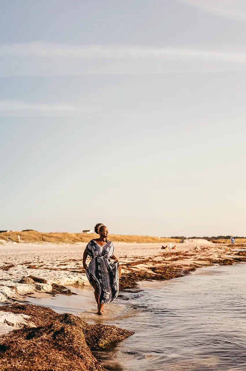woman walking in the sand at Skanör beach