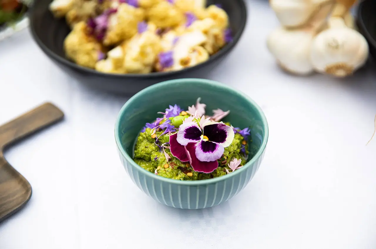 food-flower a small boulder with pesto and flowers on top