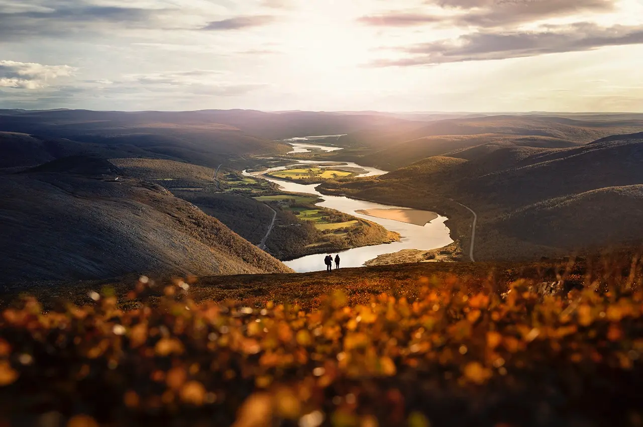 hiking-autumn hiking in the mountains with view over the river, vibrant autumn colors