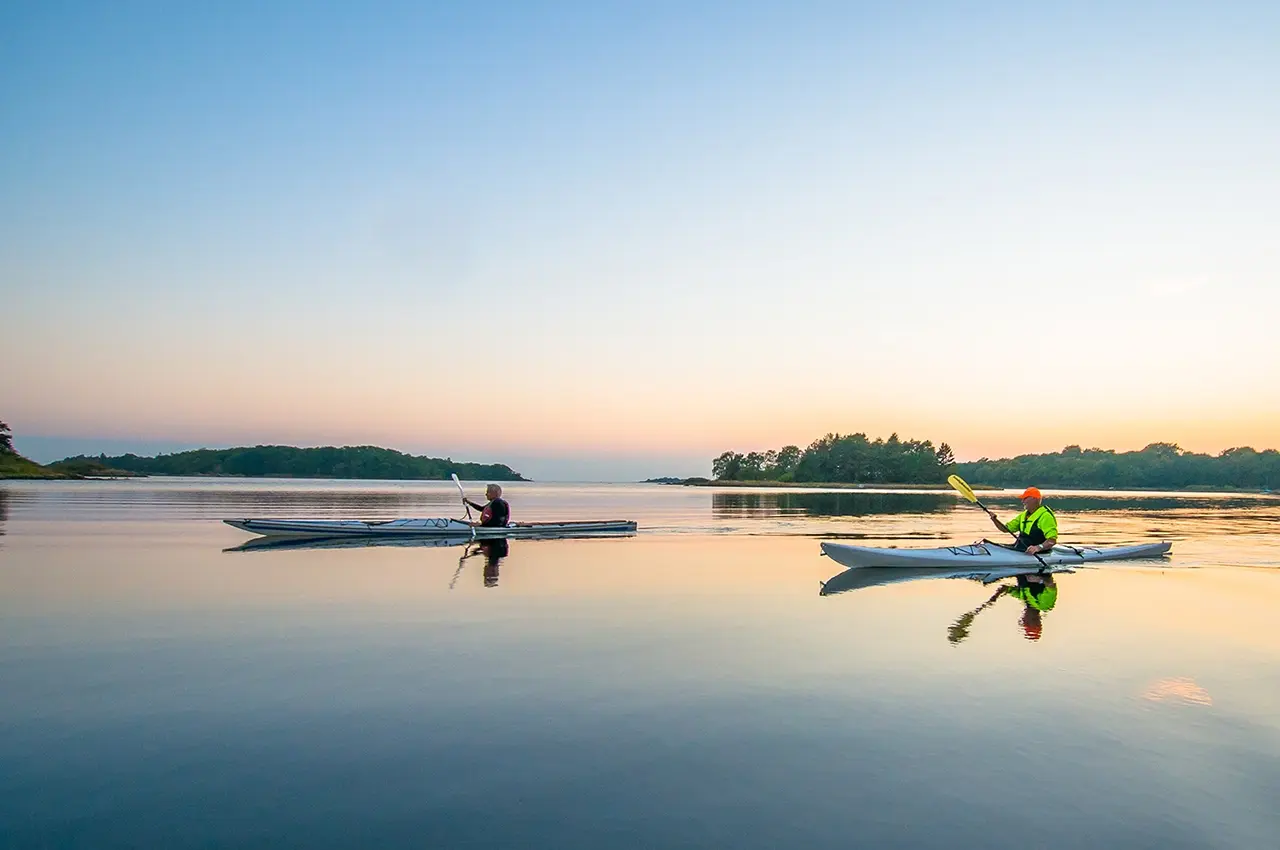 slowly kayaking on a still lake. photo: Robert Ekholm