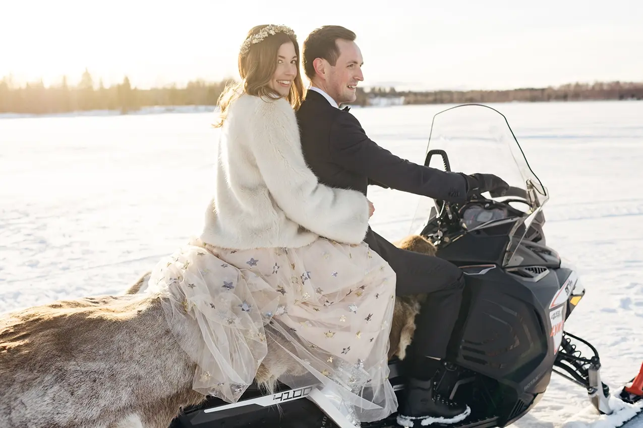 arctic-bath-wedding-snowmobile wedding couple on a snow mobile