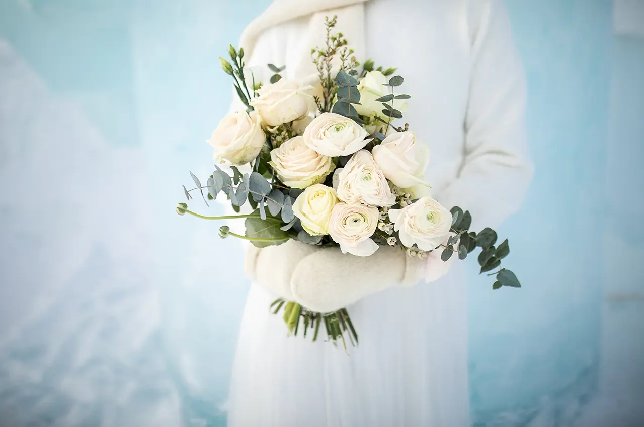 wedding-flowers-icehotel holding wedding flowers
